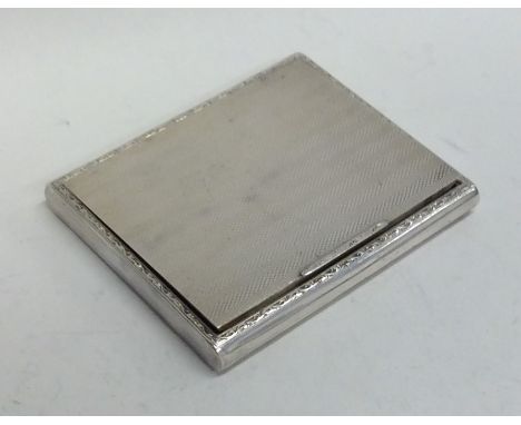 A good quality engine turned hinged top cigarette box with gilt interior. Birmingham. By WN. Approx. 117 grams. Est. £30 - £4
