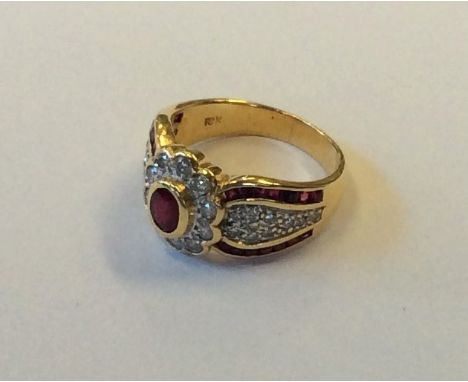 A heavy 18 carat ruby and diamond cluster ring with fancy shoulders. Approx. 6.5 grams. Est. £120 - £150.