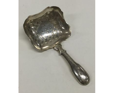 A Georgian silver bright cut caddy scoop attractively decorated with flowers. Birmingham. By IB. Approx. 6.8 grams. Est. £40 