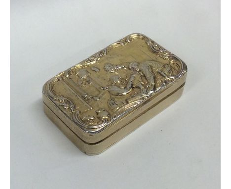 A good quality Georgian silver gilt snuff box, the cover in high relief decorated with figures. London. By JL. Approx. 132 gr