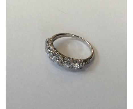 A good quality platinum five stone half hoop ring. Approx. 3.5 grams. Est. £1000 - £1500.