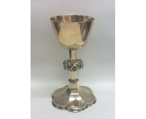 JOHN HARDMAN: A rare Victorian silver gilt and enamel chalice attractively decorated with flowers and leaves. Birmingham. App