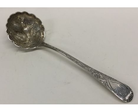 A Georgian silver chased ladle decorated with flowers and fruit. London. By WE. Approx. 70 grams. Est. £35 - £45.