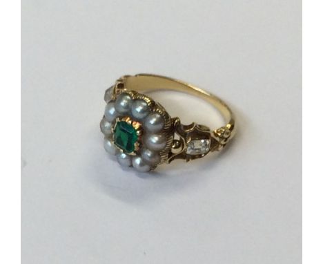 A good quality emerald, pearl and diamond Antique ring in claw mounts. Approx. 4.9 grams. Est. £1000 - £1500.