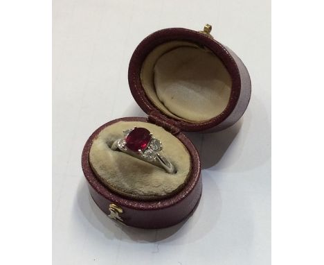 A good ruby and diamond five stone ring in 18 carat claw mount. Approx. 3.6 grams. Est. £400 - £600.