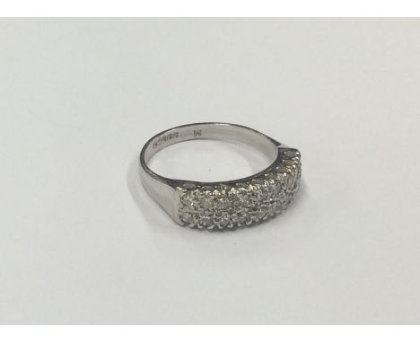 A good diamond two row half eternity ring in 18 carat white gold. Approx. 5 grams. Est. £100 - £150.