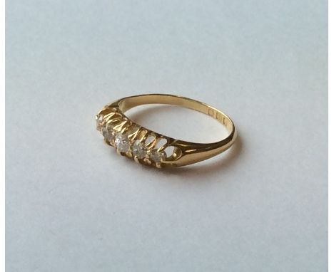 A good diamond five stone half hoop ring in 18 carat mount. Approx. 4 grams. Est. £80 - £120.