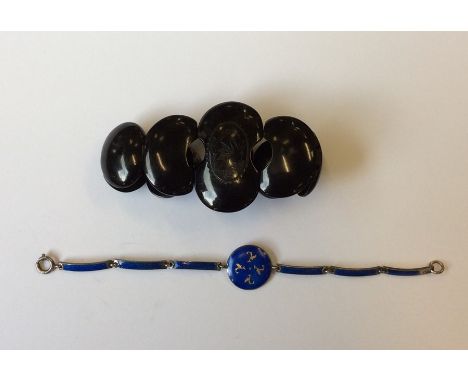 A jet panel bracelet together with a blue enamel bracelet. Est. £20 - £30.