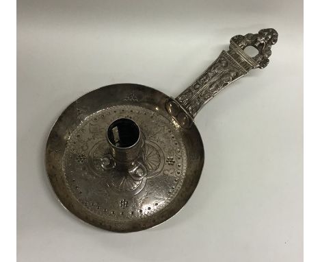 A Continental silver chamber stick attractively decorated with scrolls and bead work. Punched to side, 'ID'. Approx. 183 gram