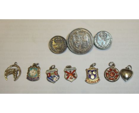 Selection of enamel fobs including Whitby, coin brooch, pendants etc.