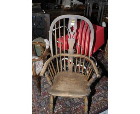 Elm stick back Windsor arm chair with H shaped under stretcher and turned supports