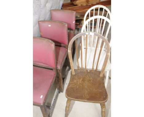 Three stick back chairs and three oak dining chairs with leatherette covers