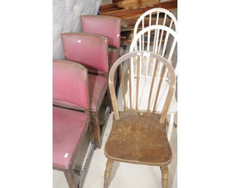 Three stick back chairs and three oak dining chairs with leatherette covers