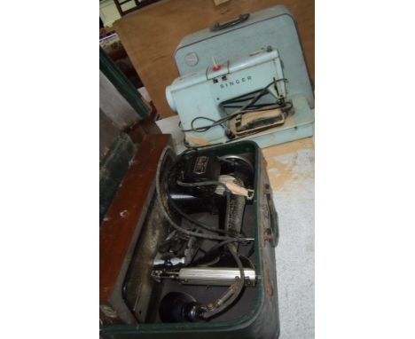 Two cased vintage Singer sewing machines