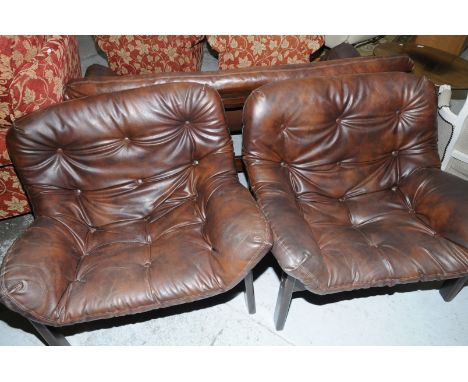 1960/70 Danish design three piece suite comprising three seat sofa and matching arm chairs with mahogany effect frames and re