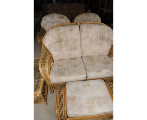 Five piece wicker conservatory suite comprising of two seat sofa, pair of matching armchairs, footstool and two tier rectangu