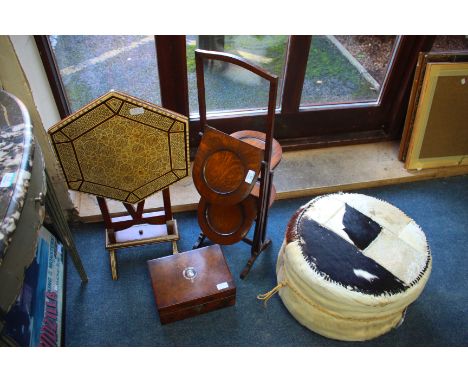 AN OAK FOUR TIER FOLDING CAKE STAND, a folding hexagonal Egyptian inlaid occasional table. a cow hide pouffe and a walnut van