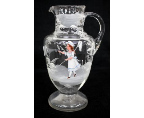 AN OLD MARY GREGORY STYLE ENAMEL DECORATED GLASS JUG, 23cm high