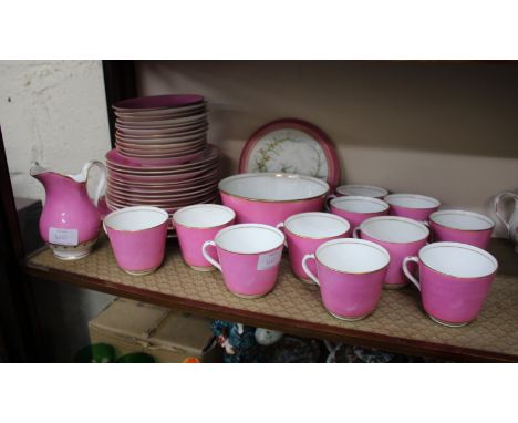 A 19TH CENTURY PINK GROUND PORCELAIN TEA SERVICE to include 11 cups