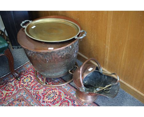 AN OLD COPPER LOG BIN of riveted construction with tubular base and circular lid, 54cm diameter together with an old oval bra