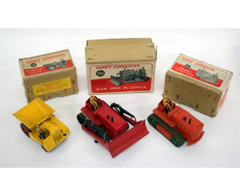 A DINKY SUPERTOYS BLAW KNOX BULLDOZER NUMBER 561 in red paint and within a cardboard box with red and white printed label tog