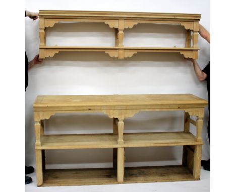 AN OLD PINE KITCHEN DRESSER with hanging shelf above a side table with two undertiers and with square tapering supports, 186c