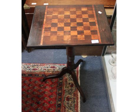 A 19TH CENTURY RECTANGULAR GAMES TABLE with a turned support and tripod base, 47cm wide