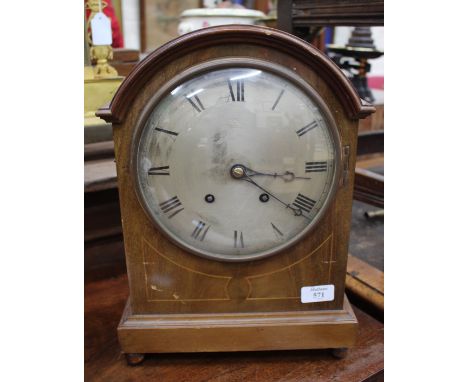 A LATE 19TH/EARLY 20TH CENTURY MAHOGANY CASED TABLE CLOCK, the silver dial with black Roman numerals and striking on a gong, 