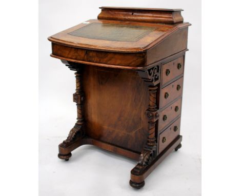 A VICTORIAN WALNUT DAVENPORT DESK with decorative boxwood inlay with pen box to the top, leather inset fall flap enclosing a 