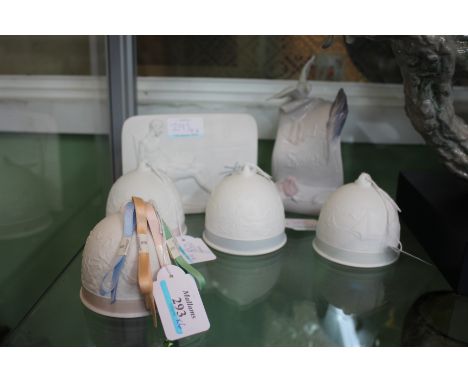 A SET OF FOUR LLADRO BISQUE PORCELAIN BELLS with decoration, possibly representing the four seasons and also two Lladro Porce