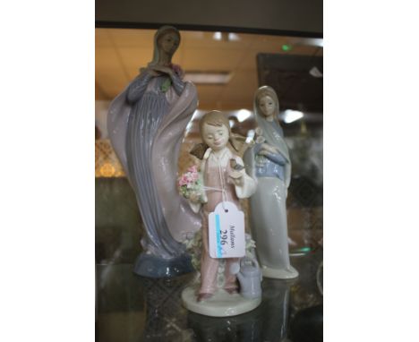 A LLADRO PORCELAIN FIGURAL SCULPTURE of a lady with flowing cloak holding a bunch of flowers, 31cm high together with a furth