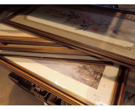 Shelf of mixed prints