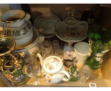 Shelf of mixed ceramics and glass