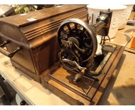 Cased vintage hand cranked Singer sewing machine