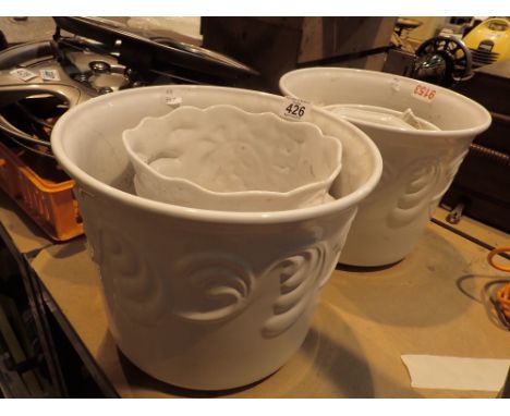 Six white ceramic planters 