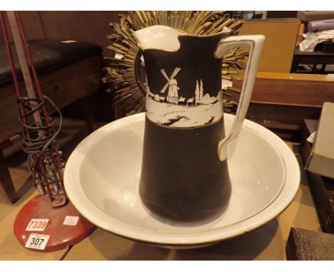 Ceramic wash bowl and jug with white country landscape design on black ground with gold ledging 