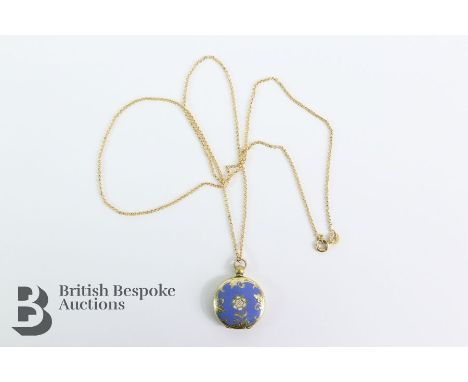 Blue and white enamel locket. The circular locket of floral design of 20mm and 5.5 gms suspended from a 14/15ct gold chain 54