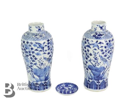 Chinese blue and white baluster vases, painted with birds on a rocky outcrop surrounded by tree peony and butterflies, approx