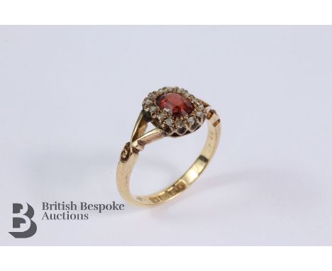 Antique 18ct gold garnet and diamond ring. The ring set with an oval-cut garnet approx 6 x 5 x 3.5mm, size M, Birmingham hall