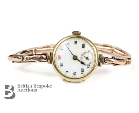 9ct gold lady's cocktail watch, the watch having a white enamel face with Roman dial and subsidiary minute dial on a 9ct gold