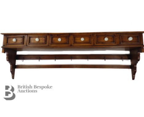 Oak wall mounted pot rack, having six small spice drawers with six pot hooks beneath, approx 142 cms in length.&nbsp;