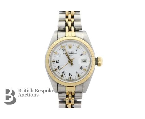 Ladies Rolex Oyster Perpetual Datejust Bi-Metal wrist watch. The watch having a white enamel face with gold baton and Arabic 