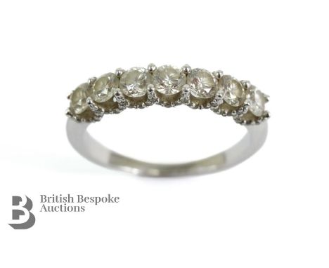 14ct white gold diamond ring. The ring set with seven stones approx 1.2 cts E-H VVS1- VVS2, size P, approx 2.95 gms complete 