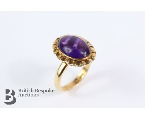 14ct yellow gold cabochon amethyst ring, 13 x 10 mm, size K+, 4.73 gms.&nbsp;