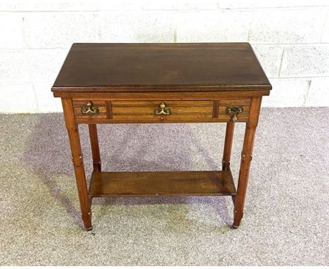 An Edwardian swivel topped folding card table, with three frieze drawers, 76cm high, 78cm wide