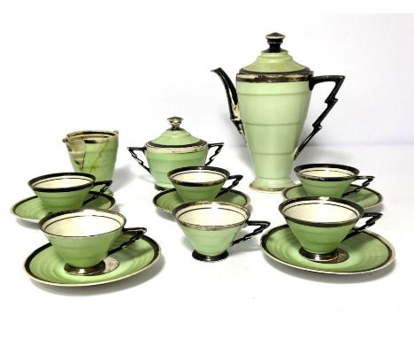 An Art Deco porcelain tea service, mid 20th century, of tapered form with a lime green ground and silvered lining (16)