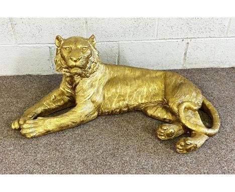 A large modern gold surfaced model of a reclining Tiger, 103cm long