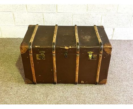 A vintage overseas travel trunk, with wood bindings, 90cm wide.