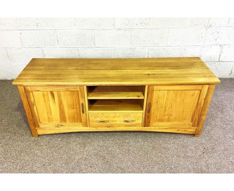 A modern light oak dresser base, with arrangement of niches, cupboards and drawers, 60cm high, 160cm wide