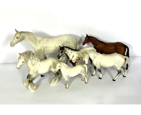 A group of Beswick and Royal Doulton models of horses, including a large Beswick model of a standing Welsh grey, 31cm high; a